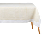 Beige cotton rectangular tablecloth with block-printed line design on a dining table