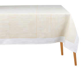 Beige cotton rectangular tablecloth with block-printed line design on a dining table