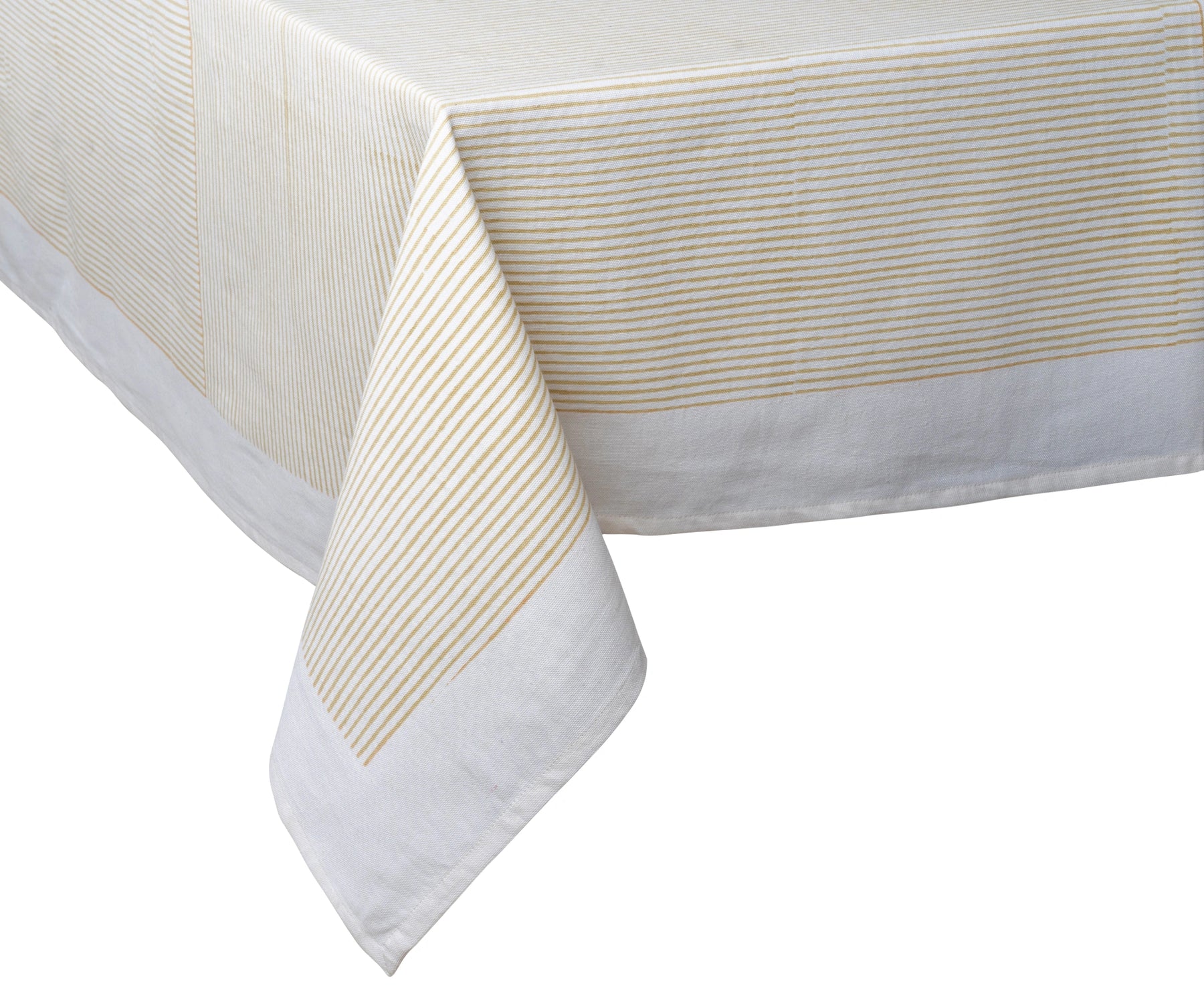 Machine-washable beige cotton tablecloth used in a formal dining setting
