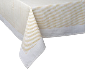 Machine-washable beige cotton tablecloth used in a formal dining setting