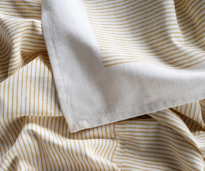 Durable beige tablecloth for rectangular tables styled in a modern kitchen