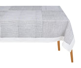 Black cotton rectangular tablecloth with traditional block print design on a dining table