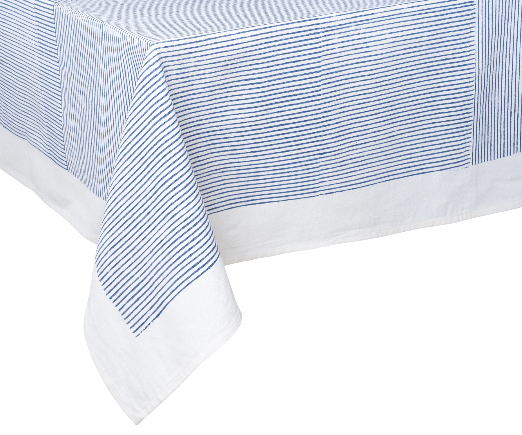 Classic blue tablecloth with minimal block print pattern in a cozy dining room