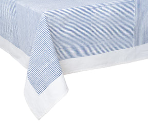 Classic blue tablecloth with minimal block print pattern in a cozy dining room