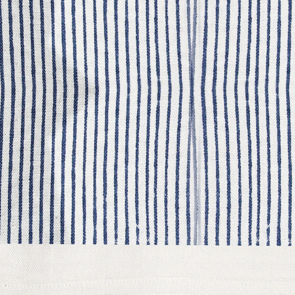 Elegant blue cotton tablecloth with floral centerpiece and wooden cutlery