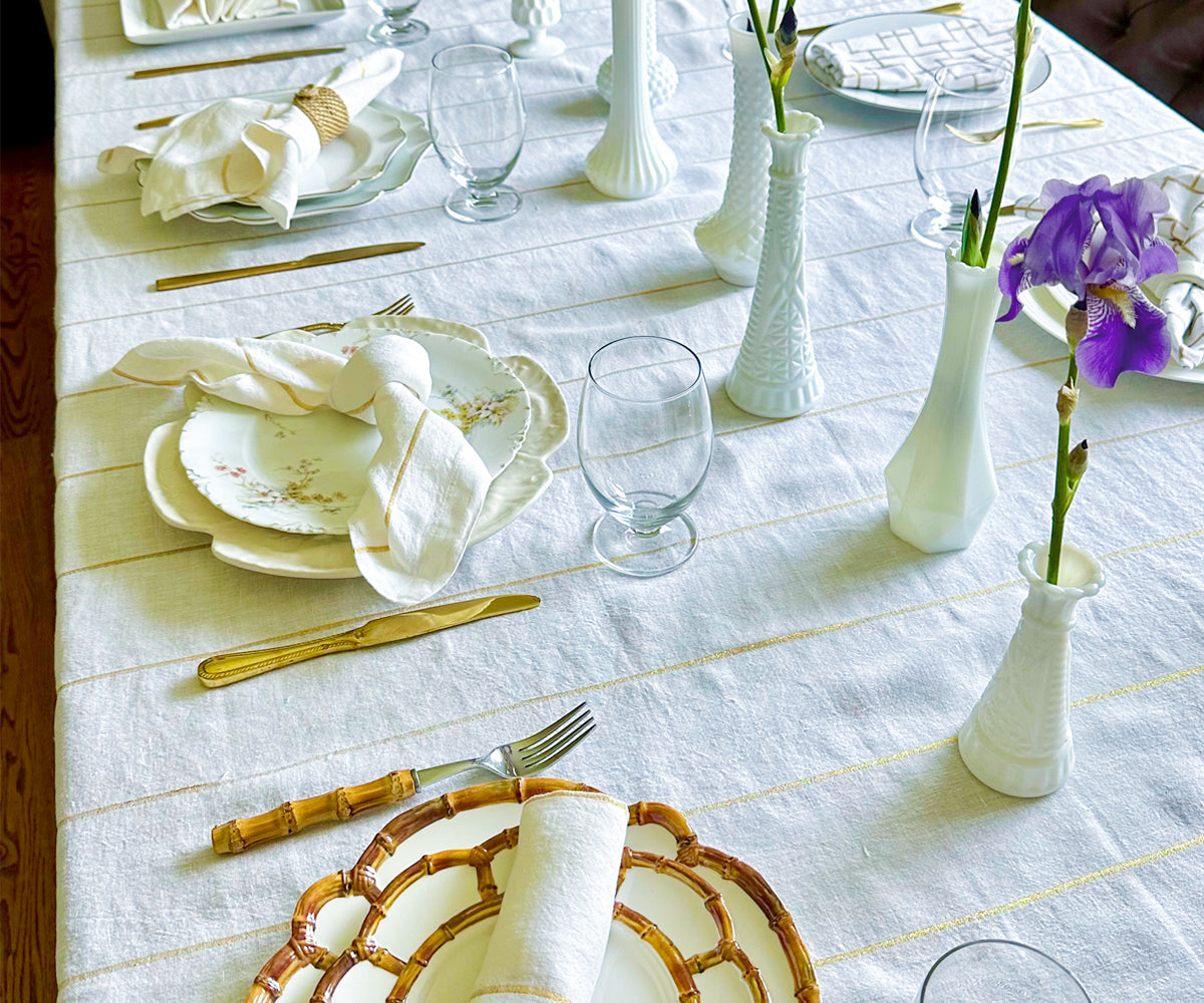 Elevate your table decor with dinner napkins gracefully folded using rings, showcased in a tasteful napkin holder, imparting an elegant touch to your dining ambiance.