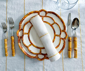 Discover an assortment of dinner napkins, including cloth and folding styles, in white and black options, perfect for enhancing your table settings.Several Reusable Cloth Napkins in a Rich Gold Color