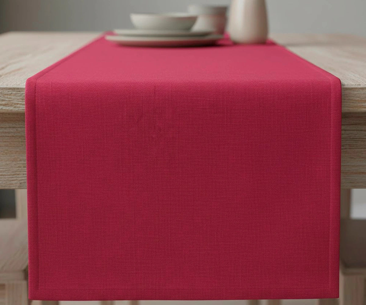 Solid red linen table runner on dining table