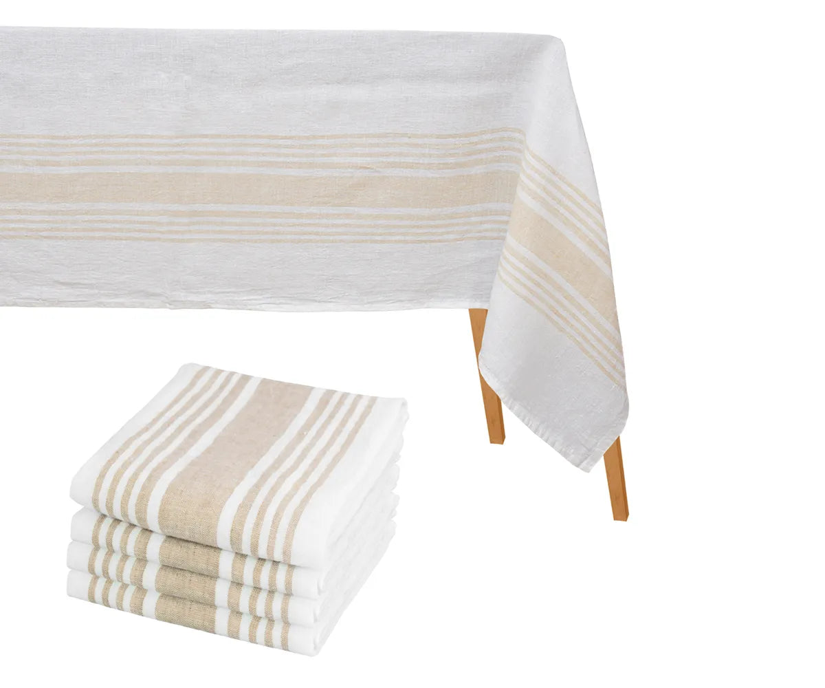 Striped cotton tablecloth and matching cloth napkins arranged neatly on a dining table