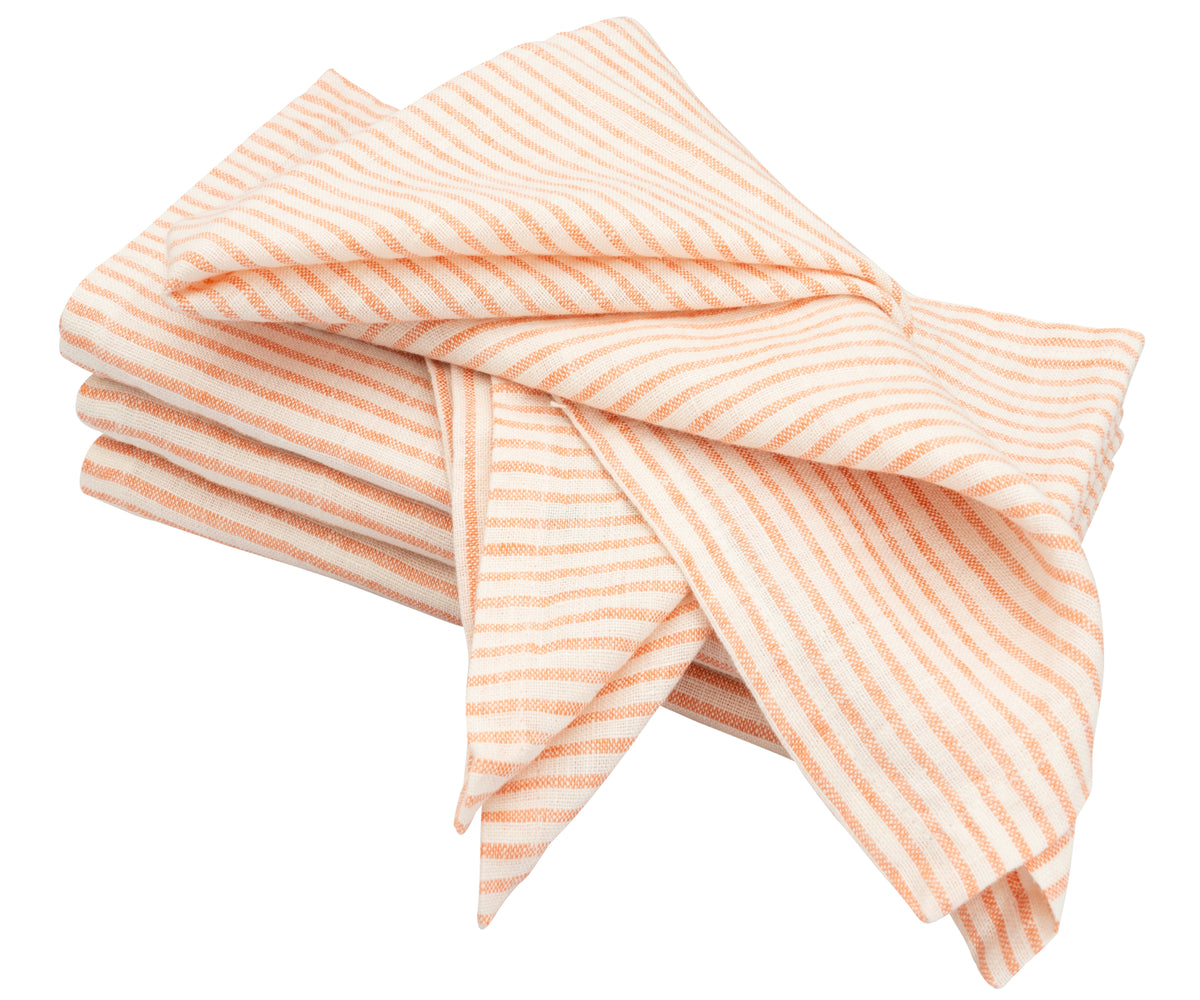 Linen napkins laid out on an outdoor table for a summer picnic scene