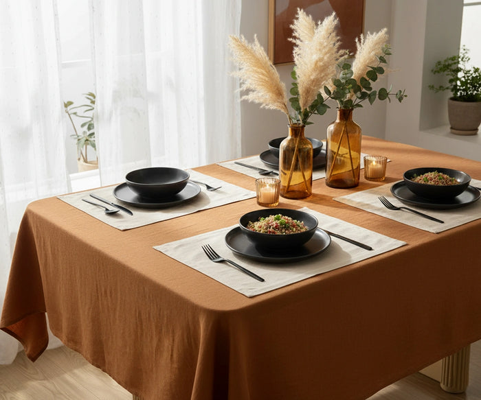 Terrocotta linen tablecloth with a simple solid design for a modern, natural tablescape.