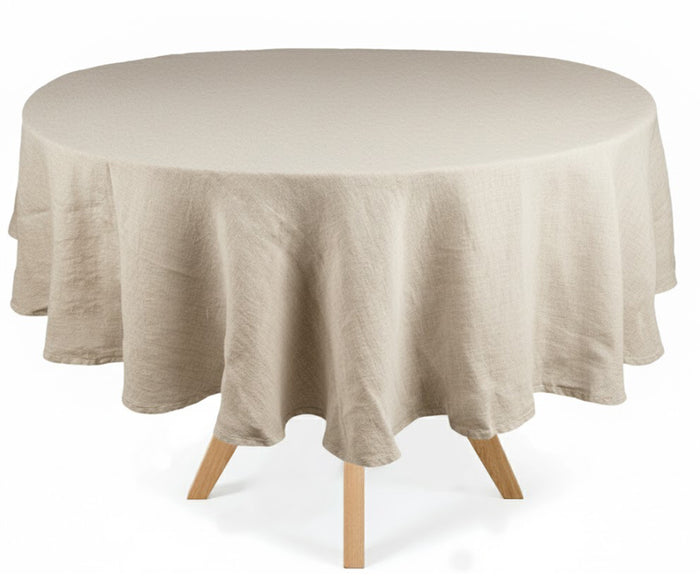 Round table with a beige linen tablecloth on a white background