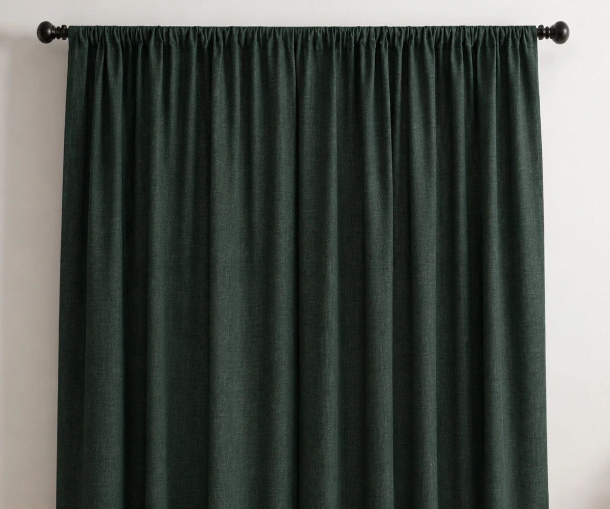 Dark green linen curtain panels with a soft gathered drape, perfect for stylish window curtains.