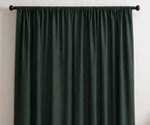 Dark green linen curtain panels with a soft gathered drape, perfect for stylish window curtains.