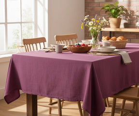 Linen tablecloth in deep fuchsia color adding sophistication to any table setting.
