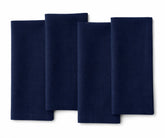 Indigo plain linen napkin neatly stacked, highlighting deep blue shade and fine weave