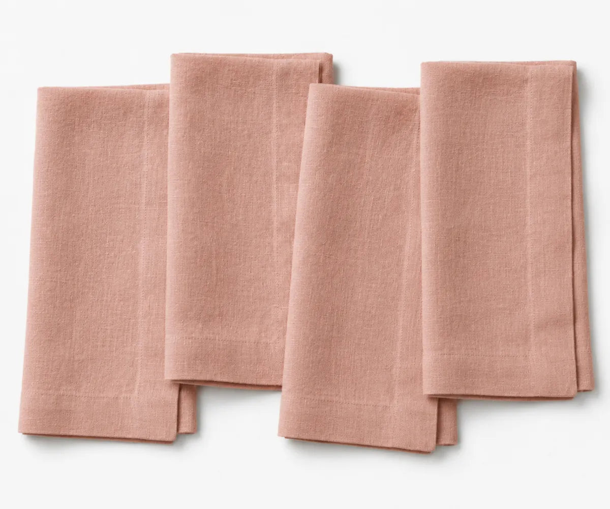 Thistle plain linen napkin in soft lavender shade, folded to highlight smooth linen texture