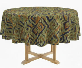 Round table with a patterned green tablecloth on a white background