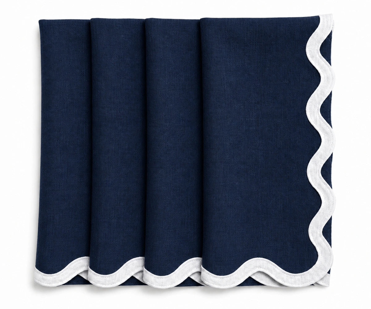 Navy blue linen scalloped napkins with white embroidered scalloped border, reusable European linen dinner napkins for weddings and elegant tablescapes.