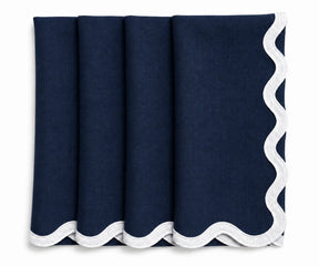 Navy blue linen scalloped napkins with white embroidered scalloped border, reusable European linen dinner napkins for weddings and elegant tablescapes.