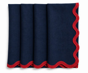 Navy blue European linen napkins finished with red scalloped embroidery, elegant reusable table linens for formal dining.