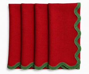Red linen scalloped napkins with green embroidered border, premium European linen scalloped edge napkins for Christmas, holiday dinners, and festive tables.