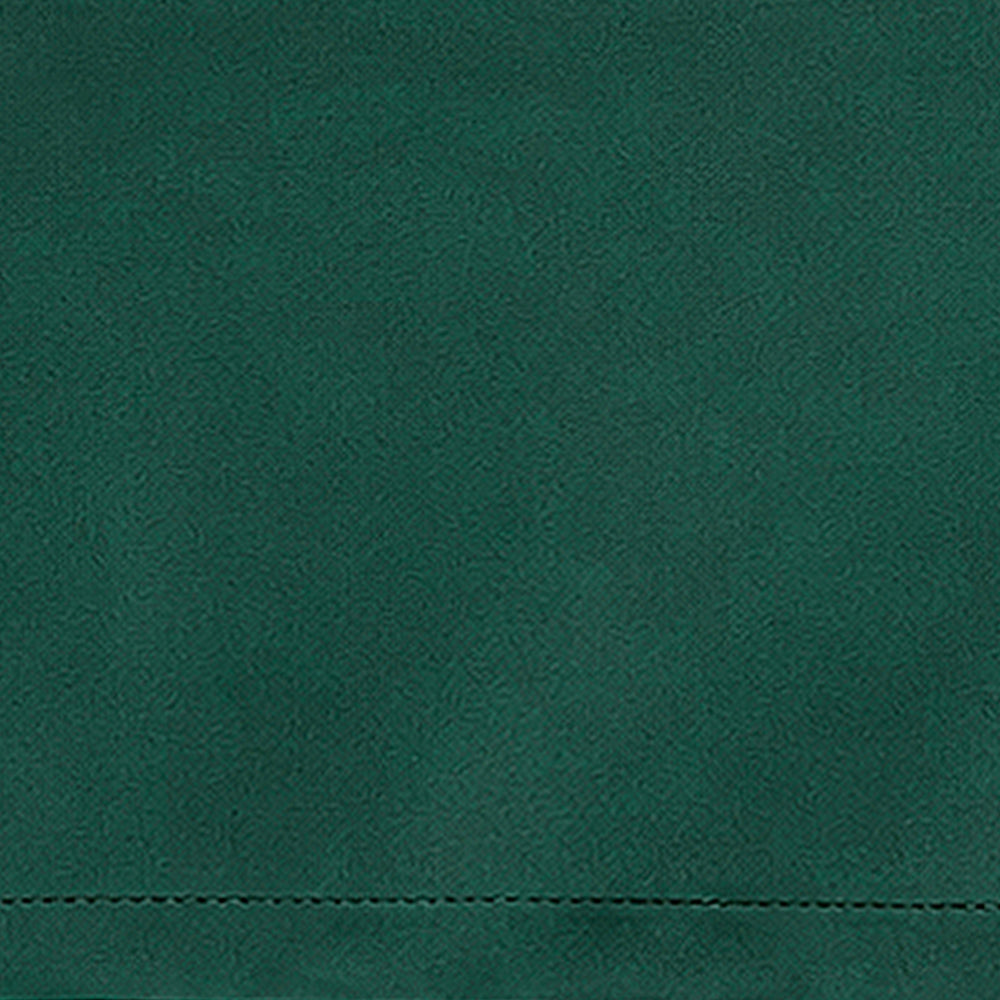 Green linen fabric swatch with fresh natural color and textured weave for botanical-inspired table décor and interiors.