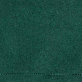 Green linen fabric swatch with fresh natural color and textured weave for botanical-inspired table décor and interiors.