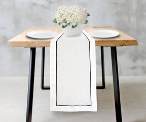 Elegant white wedding table runner with delicate cotton fabric.