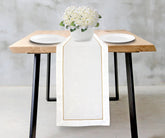 Classic cotton table runner perfect for special occasions.
