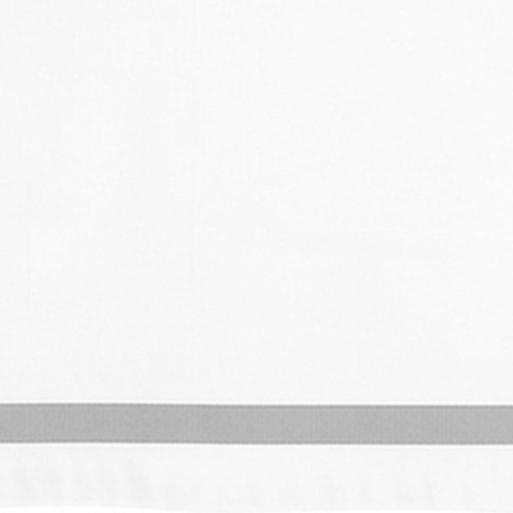 White cotton satin border tablecloth styled for a wedding or formal dining table setting