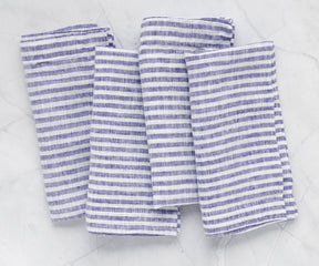 Luxury blue pinstripe linen napkins styled for bridal shower décor and upscale event table settings