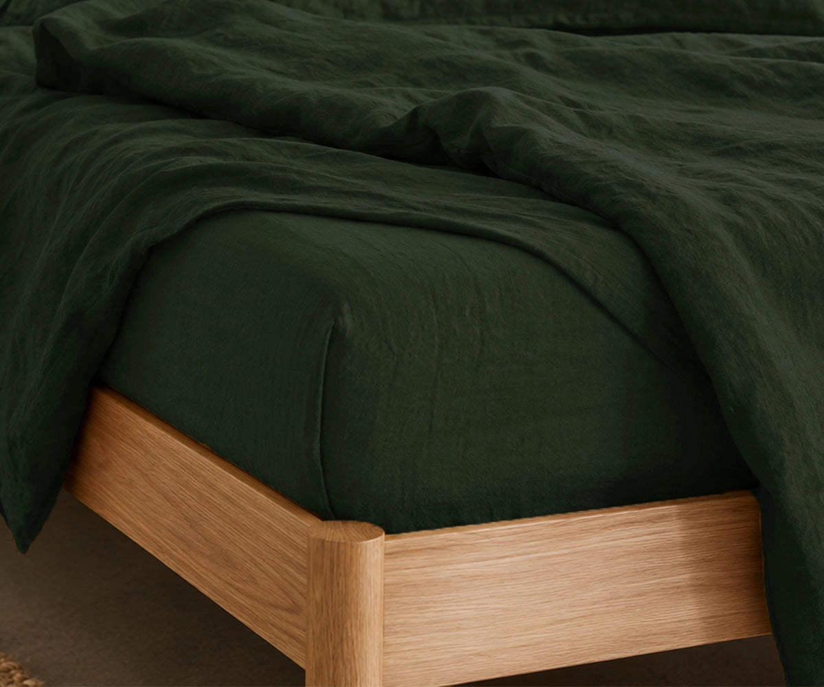 Luxury green bed sheets styled in a modern minimalist bedroom, premium linen bedding set for cozy hotel-style comfort, farmhouse decor and elegant home interiors