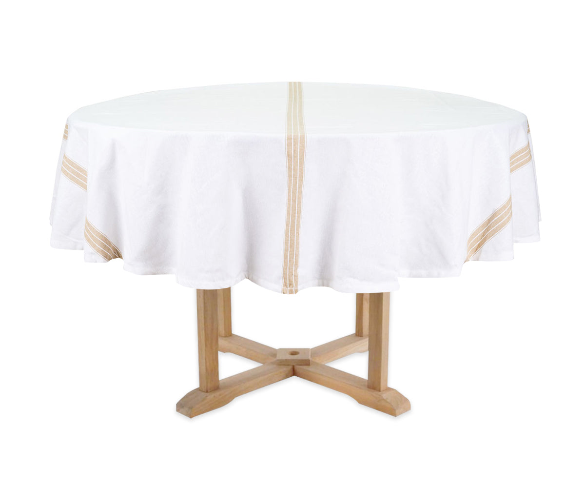 Round table with a white tablecloth featuring gold stripes on a white background