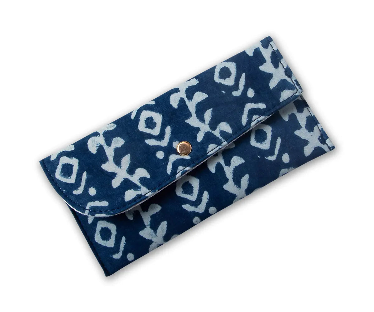 Handcrafted blue and white quilted make up bag with floral pattern and button closure