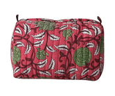 Pink quilted floral cotton cosmetic bag with green flower and white leaf print
