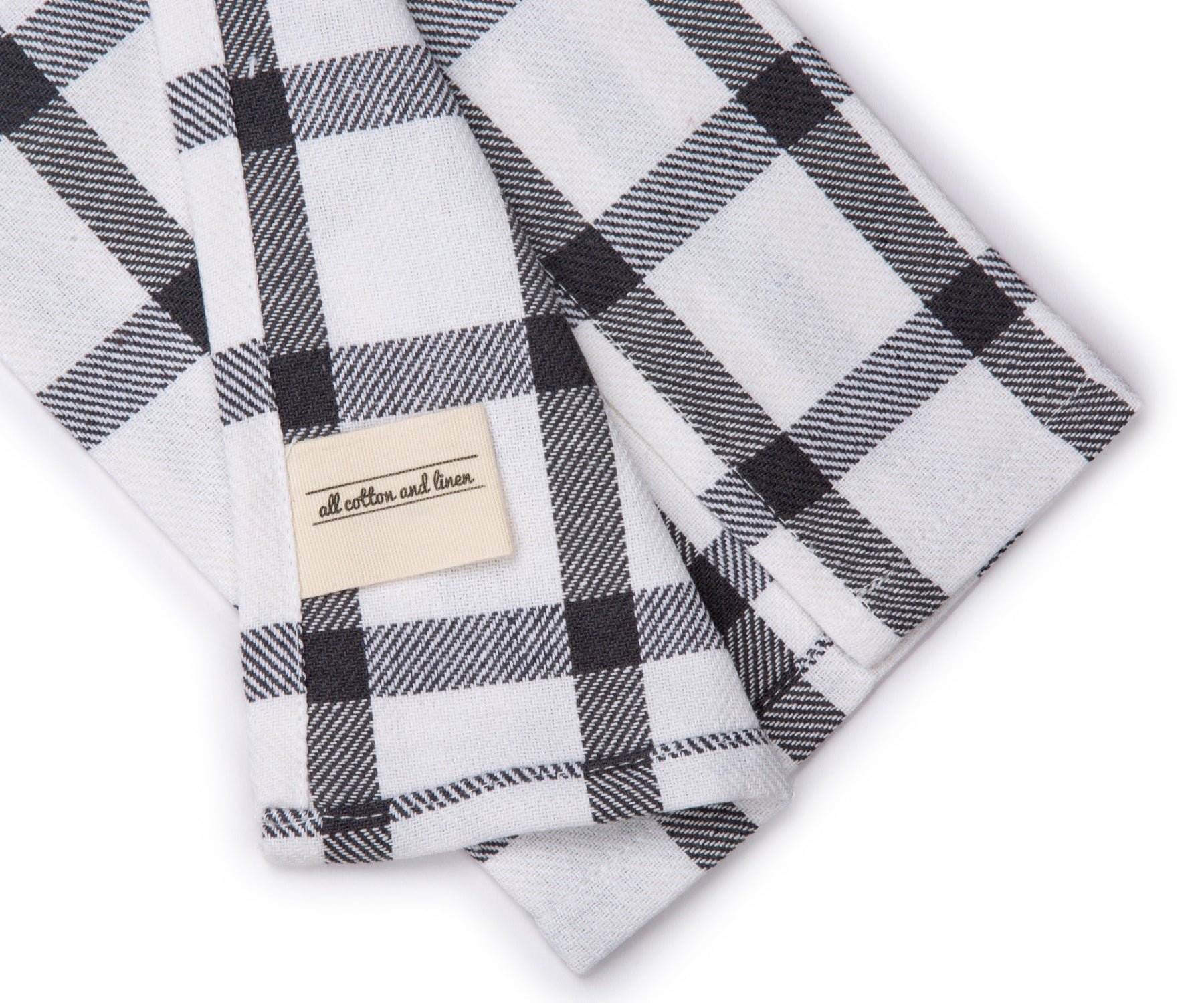Monochrome checkered dish towel with visible brand label