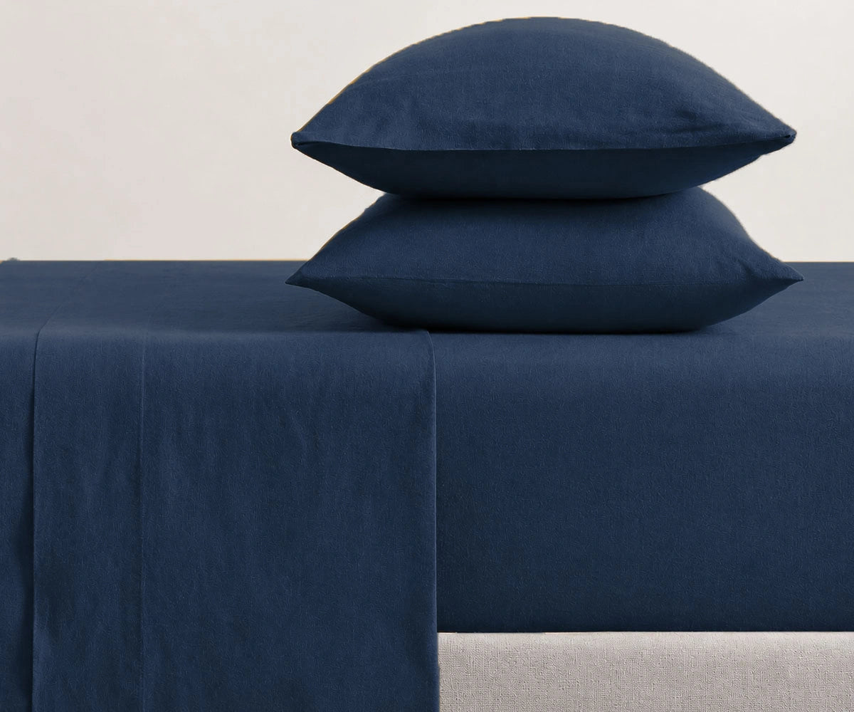 Modern bedroom styled with navy blue sheet set, premium linen bedding with pillowcases for cozy hotel-inspired and minimalist home decor