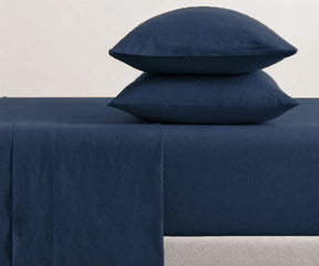 Modern bedroom styled with navy blue sheet set, premium linen bedding with pillowcases for cozy hotel-inspired and minimalist home decor