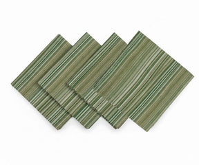 Green striped cotton dinner napkins folded and stacked for table setting