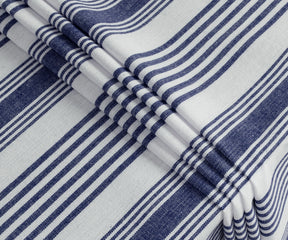 Rectangular blue and white striped cotton tablecloth covering dining table, multiple sizes