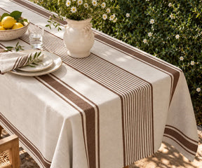 Classic striped table linen showcasing a natural woven texture for rustic dining rooms and relaxed home table settings.