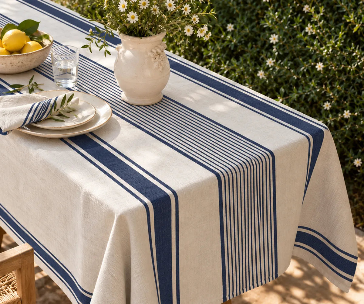 Linen table textile with an elegant stripe motif, created for French country interiors, family dinners, and seasonal dining decor.