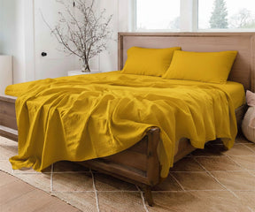 Mustard yellow 100% linen sheet set with soft washed finish and breathable comfort.
King and queen deep pocket luxury European linen bedding set for warm modern interiors.