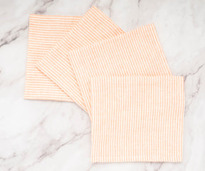 Striped napkins used in a spring-themed table setting with fresh flowers
