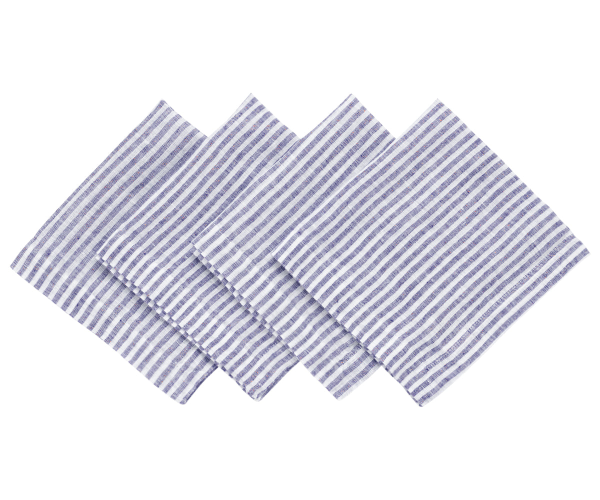 Natural linen blue pinstripe napkins featured in a sophisticated tablescape for weddings and celebrations