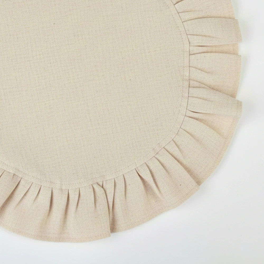 Neutral natural-toned cotton napkins with soft ruffle trim, designed for everyday use and relaxed table settings.