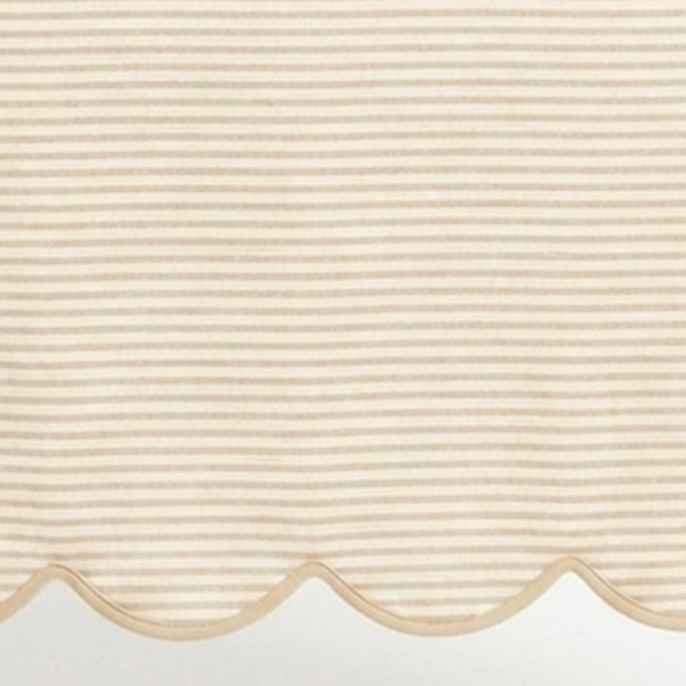 Natural linen striped tablecloth material featuring a detailed scallop hem design for neutral kitchen and dining decor.