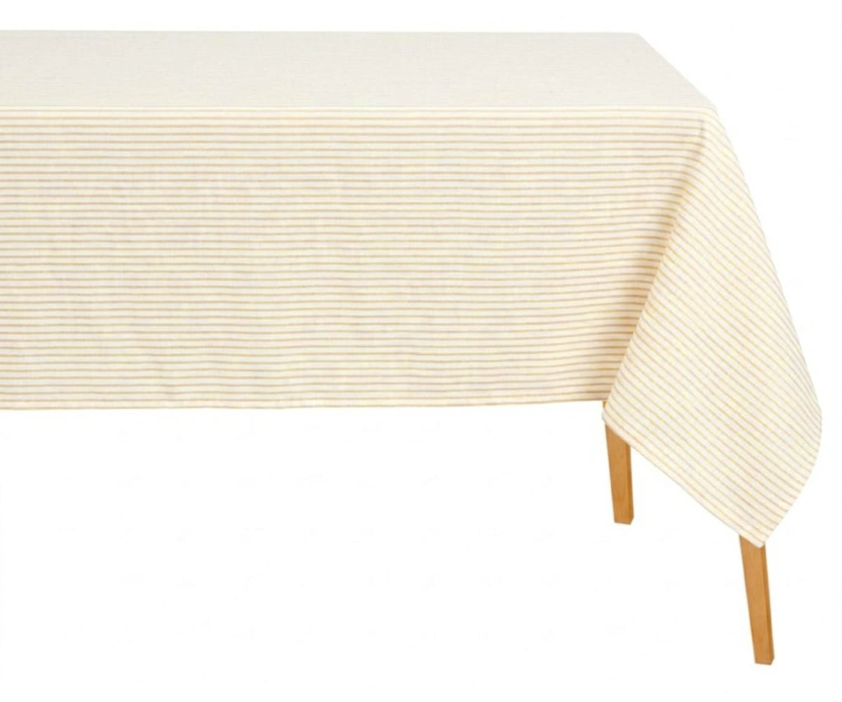 Rectangular natural and white horizontal striped cotton tablecloth draped over a wooden table against a white background.