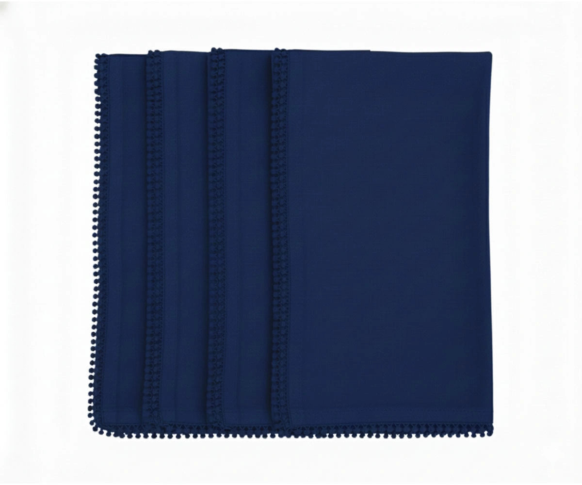 Navy blue cotton pom pom napkins with knotted edge for classic and formal table settings